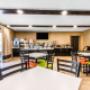 Enjoy breakfast in this seating area Enjoy breakfast in this seating area