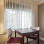 Guest room with table and chairs Guest room with table and chairs