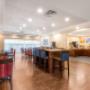 Enjoy breakfast in this seating area Enjoy breakfast in this seating area