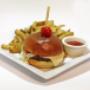 Caprese burger (beef burger topped off with mozzarella cheese, pesto and balsamic marinated tomato)and fresh cut fries. Caprese burger (beef burger topped off with mozzarella cheese, pesto and balsamic marinated tomato)and fresh cut fries.