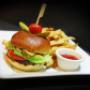 Beef burger (topped off with lettuce, tomato, onion, pickles, ketchup and garlic mayo) and fresh cut fries. Beef burger (topped off with lettuce, tomato, onion, pickles, ketchup and garlic mayo) and fresh cut fries.