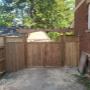 Pressure treated wooden double gates with arbor. Pressure treated wooden double gates with arbor.