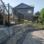 Custom fabricated ornamental iron fencing pool enclosure fencing. Set into armor stone retaining wall. Custom fabricated ornamental iron fencing pool enclosure fencing. Set into armor stone retaining wall.