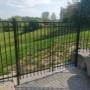 5ft High ornamental iron pool enclosure with gates. Installed into concrete pad and armor stone retaining wall. 5ft High ornamental iron pool enclosure with gates. Installed into concrete pad and armor stone retaining wall.