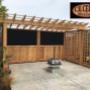 CV Cedar Outdoor Space Feature in Western Red Cedar and Corrugated Metal, including Pergola and Square Lattice Fence Panels. CV Cedar Outdoor Space Feature in Western Red Cedar and Corrugated Metal, including Pergola and Square Lattice Fence Panels.