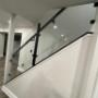 Glass railing with custom weld metal post Glass railing with custom weld metal post