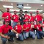 Employees pose for a photograph holding milkshakes outside the kitchen ahead of the reopening of the Five Guys restaurant in East Gwillimbury, Ontario, Canada. Employees pose for a photograph holding milkshakes outside the kitchen ahead of the reopening of the Five Guys restaurant in East Gwillimbury, Ontario, Canada.