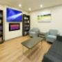 Lounge seating with books, TV and fireplace. Lounge seating with books, TV and fireplace.
