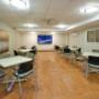 Social room with tables, chairs and TV for entertaining. Social room with tables, chairs and TV for entertaining.