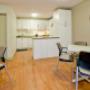 Social room also includes a kitchen. Social room also includes a kitchen.