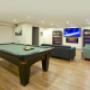Billiards room with lounge seating and TV. Billiards room with lounge seating and TV.