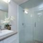 Bathroom with stand-up shower and modern cabinetry. Bathroom with stand-up shower and modern cabinetry.
