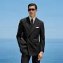 This black striped suit is cut to a tailored fit, offering a refined silhouette with structured shoulders. Paired with slim trousers featuring side-adjusters and a flat front for modern sophistication. This black striped suit is cut to a tailored fit, offering a refined silhouette with structured shoulders. Paired with slim trousers featuring side-adjusters and a flat front for modern sophistication.