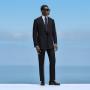 This navy suit is cut to a tailored fit, featuring structured shoulders for a sharp silhouette. Paired with slim trousers, it includes belt loops and a flat front for a clean, modern look. This navy suit is cut to a tailored fit, featuring structured shoulders for a sharp silhouette. Paired with slim trousers, it includes belt loops and a flat front for a clean, modern look.