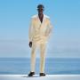 This light yellow suit is cut to a tailored fit, offering a sleek silhouette with structured shoulders. Paired with flat-front trousers featuring side-adjusters for a modern look. This light yellow suit is cut to a tailored fit, offering a sleek silhouette with structured shoulders. Paired with flat-front trousers featuring side-adjusters for a modern look.