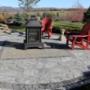 A relaxing side patio with fireplace . A relaxing side patio with fireplace .