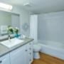 Bedroom with tub shower at Springbank Apartments in London, ON Bedroom with tub shower at Springbank Apartments in London, ON
