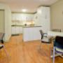 Social room also includes a kitchen. Social room also includes a kitchen.