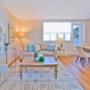 Brightly lit living room with custom roll-up blinds. Brightly lit living room with custom roll-up blinds.
