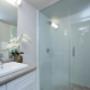 Bathroom with stand-up shower and modern cabinetry. Bathroom with stand-up shower and modern cabinetry.