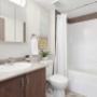Bathroom with tub shower at Hollick Kenyon in Edmonton, AB Bathroom with tub shower at Hollick Kenyon in Edmonton, AB
