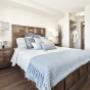 Bedroom with luxury vinyl plank flooring at Hollick Kenyon in Edmonton, AB Bedroom with luxury vinyl plank flooring at Hollick Kenyon in Edmonton, AB