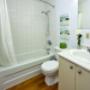 Bathroom with tub shower at London Road Apartments in Sarnia, ON Bathroom with tub shower at London Road Apartments in Sarnia, ON