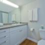 Modern bathroom with large mirror at Bay Terrace Apartments in Belleville, ON Modern bathroom with large mirror at Bay Terrace Apartments in Belleville, ON