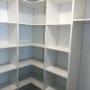 Simple pantry in Surrey with lots of shelf storage Simple pantry in Surrey with lots of shelf storage