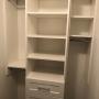 Closet in master walk in. Hanging system with drawers and shelves Closet in master walk in. Hanging system with drawers and shelves
