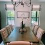 These black-banded Roman shades really add some flare to this dining area. These black-banded Roman shades really add some flare to this dining area.