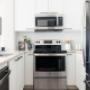 Inlet Station in Port Moody, BC bright, open-concept kitchen with stainless steel appliances Inlet Station in Port Moody, BC bright, open-concept kitchen with stainless steel appliances