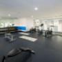 Exercise room with cardio equipment and weights Exercise room with cardio equipment and weights