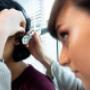 Audiologist, Heather Ritchie, checking a client's ears. Audiologist, Heather Ritchie, checking a client's ears.