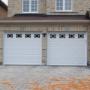The Door Master- Traditional Raised Panel garage door with Waterton windows The Door Master- Traditional Raised Panel garage door with Waterton windows