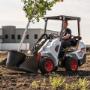 A Bobcat L23 small articulated loader with bucket attachment A Bobcat L23 small articulated loader with bucket attachment
