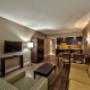 1 Bedroom Suite-King Bed-Pool View Living Room 1 Bedroom Suite-King Bed-Pool View Living Room