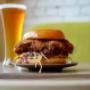 Crispy chicken burger paired with an ice-cold beer.
Burger au poulet croustillant accompagné d’une bière bien fraîche. Crispy chicken burger paired with an ice-cold beer.
Burger au poulet croustillant accompagné d’une bière bien fraîche.