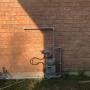 Natural gas BBQ line connected to the gas meter and run along the side of the house, neatly painted grey. Natural gas BBQ line connected to the gas meter and run along the side of the house, neatly painted grey.
