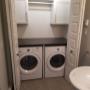 Custom laundry cabinets, hang rod and countertop Custom laundry cabinets, hang rod and countertop