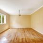Empty room. The job was a move-in clean for this new client. Signed up for our service on a recurring basis afterwards. The walls are a light brown honey colour. The floors are hardwood and multi-coloured. A lone lamp hangs from the ceiling. Empty room. The job was a move-in clean for this new client. Signed up for our service on a recurring basis afterwards. The walls are a light brown honey colour. The floors are hardwood and multi-coloured. A lone lamp hangs from the ceiling.