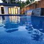 pool cabana with washroom, entertainment area and storage, waterfall feature, interlock around the pool pool cabana with washroom, entertainment area and storage, waterfall feature, interlock around the pool