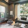 Layered textures and soft, flowing drapery with a structured Roman shade create a cozy yet refined look in this space Layered textures and soft, flowing drapery with a structured Roman shade create a cozy yet refined look in this space