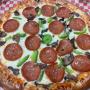 Delicious Pizza with : Mushrooms, peperroni, green peppers Delicious Pizza with : Mushrooms, peperroni, green peppers