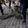 Builders poured concrete at the construction site Builders poured concrete at the construction site