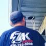 One of our team members installing outdoor lighting. One of our team members installing outdoor lighting.