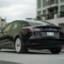 A parked Tesla available for rent from Roam Monthly Car Subscriptions & Rentals A parked Tesla available for rent from Roam Monthly Car Subscriptions & Rentals