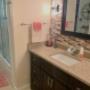 Bathroom re-model complete with travertine tile, backsplash, vanity and new tub enclosure. Bathroom re-model complete with travertine tile, backsplash, vanity and new tub enclosure.