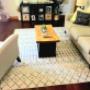The installation of new engineered hardwood replaces the old carpet in this livingroom. The installation of new engineered hardwood replaces the old carpet in this livingroom.
