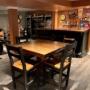 The installation of vinyl flooring, drywall, paint and custom bar completes this basement family room. The installation of vinyl flooring, drywall, paint and custom bar completes this basement family room.